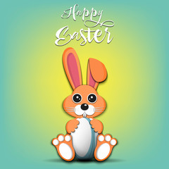 Rabbit with easter egg decorated in the form of a rugby ball