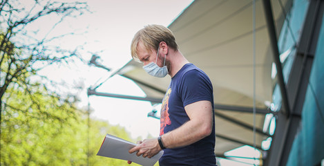 Coronavirus covid-19 disinfection. Portrait caucasian Men with a protective mask, biological hazard