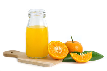 Fresh orange juice above wood coaster, with raw, sliced orange fruit – isolated on white background