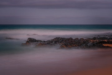 Long exposure view of Playa del Dormidero Beach or Playa El Viejo, located at Grandes Playas Corralejo - Fuerteventura, Canary Islands, Spain. October 2019