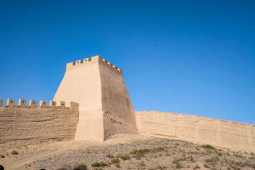 The majestic Jiayuguan City watchtower in Gansu Province, China. Chinese characters on black plaque: Jiayuguan.The majestic Jiayuguan Great Wall Corner Tower in Gansu , China.The turret of the wall