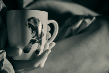mug in the hands of comfort