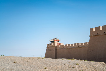 The majestic Jiayuguan City watchtower in Gansu Province, China. Chinese characters on black plaque: Jiayuguan.The majestic Jiayuguan Great Wall Corner Tower in Gansu , China.The turret of the wall © Liu Lei