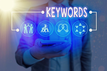 Conceptual hand writing showing Keywords. Concept meaning word which acts as the key to a code...