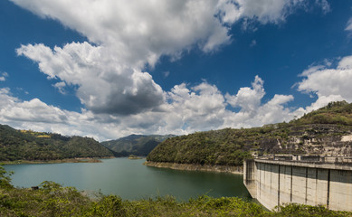 Obraz na płótnie Canvas dramatic image of Presa Jiguey dam high in the caribbean mountains of the dominican republic.