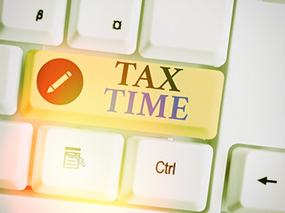 Conceptual hand writing showing Tax Time. Concept meaning compulsory contribution state revenue...