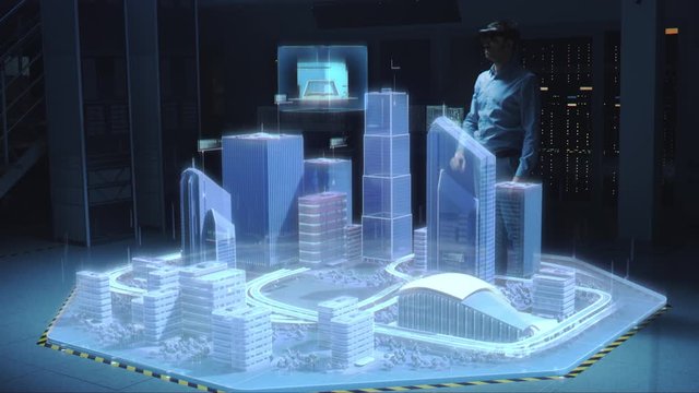 Industry 4.0: Modern Professional Architect Wearing Virtual Reality Headset Uses Gestures to Move, Design, Manipulate Buildings for 3D City. Mixed Augmented Reality Software. VFX Special Visual Effect