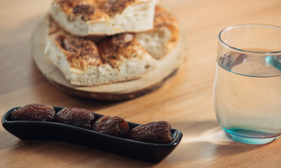 simple ramadan table. Date, ramadan bread, water. the breaking of the ramadan fast. iftar dinner.