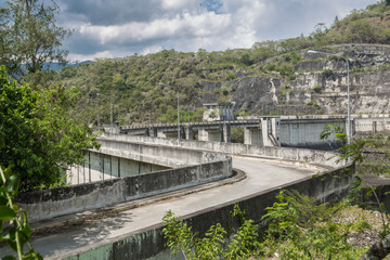 dramatic image of Presa Jiguey Dam highn in the caribbean mountains of the dominican republic.