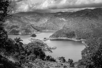 dramatic black and white image of Dam Presa Jiguey in the caribbean mountains of the  dominican...