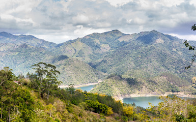 dramatic image of a small Caribbean home near Presa Jiguey, Dominican republic in the mountain countryside.