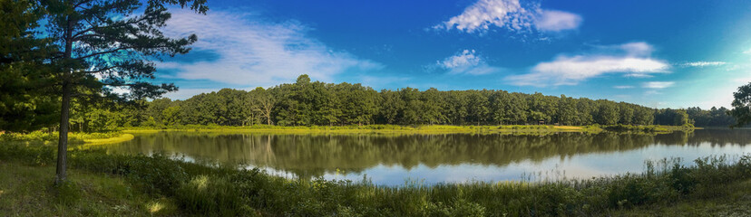 Fototapeta na wymiar Peaceful Tranquil Hiking Pathway along the Lake.. water reflection