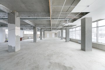 empty pure commercial office building undecorated in gray colors.open space office