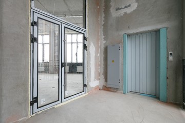 empty pure commercial office building undecorated in gray colors.open space office