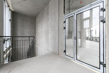 empty pure commercial office building undecorated in gray colors.open space office