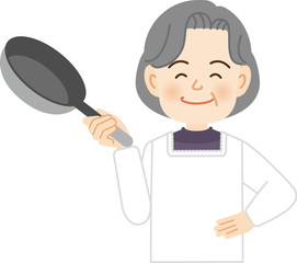 フライパンを持つ高齢女性