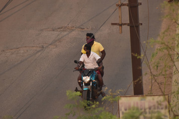 Two person going on bike for purchasing essentials during lock down in india, due to covid or corona.