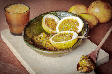 Home kitchen with passion fruit on the table preparing juices and desserts. Concept of freshness and color.