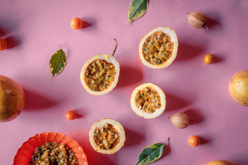 Passion fruit still life on a background of pink tablecloths. Concept of tropical, freshness,...