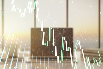 Multi exposure of abstract financial graph on laptop background, financial and trading concept