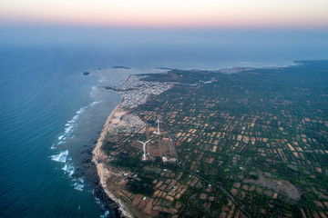 Obraz premium Aerial view of landscape with Turbine Green Energy Electricity, Windmill for electric power production, Wind turbines generating electricity on Phu Qui island, Binh Thuan, Vietnam. 