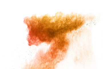 Fototapeta premium Launched orange powder onwhite background