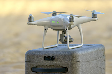 Uav drone copter flying with digital camera above opencast mining quarry. Nha Trang, Vietnam

2