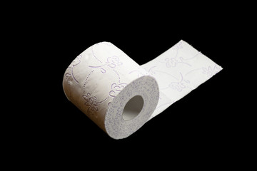 Toilet paper roll isolated on black. Soft tissue background. Bathroom hygiene concept