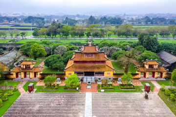 Fototapeta na wymiar Wonderful view of the “ Meridian Gate Hue “ to the Imperial City with the Purple Forbidden City within the Citadel in Hue, Vietnam. Imperial Royal Palace of Nguyen dynasty in Hue. The To Mieu house