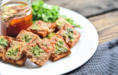Fried toasts with Minced Pork Spread with chili sauce (Thai Pork Toast) . Toasts Menu for children.