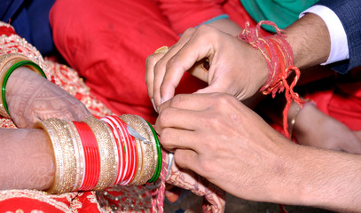 Indian couple playing Ring Fishing game in wedding ceremony of India