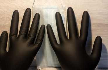 black rubber gloves on a light background