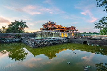Fototapeta premium Wonderful view of the “ Meridian Gate Hue “ to the Imperial City with the Purple Forbidden City within the Citadel in Hue, Vietnam. Imperial Royal Palace of Nguyen dynasty in Hue. Hue is a popular 