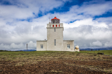 Fototapeta na wymiar Lighthouse of Dyrholaey formerly known as Cape Portland located on the south coast of Iceland