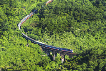 Aerial view of train and railway on Hai Van pass, Bach Ma mountain, Hue, Vietnam