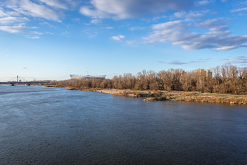 Bank of River Vistula and National Stadium seen from Lazienkowski bridge in Warsaw, capital city of Poland