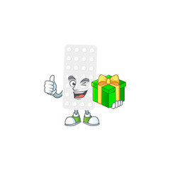 Smiley pills cartoon character holding a gift box