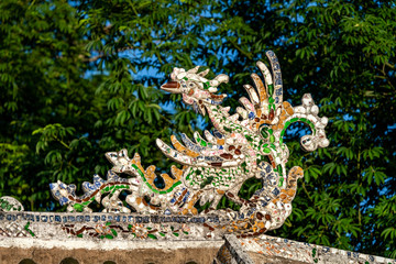 Wonderful view of the "Cau Ngoi Thanh Toan " or Thanh Toan tile bridge near Imperial City with the Purple Forbidden City within the Citadel in Hue, Vietnam. 