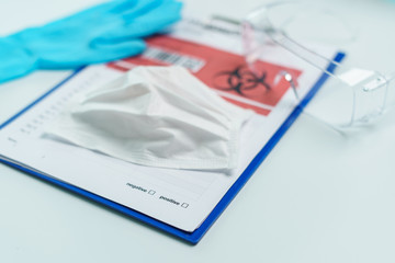 Fototapeta premium Healthcare and medicine card of coronavirus disease on clipboard with personal protection equipment.