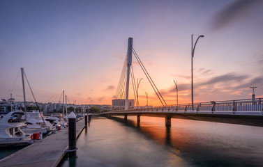 Fototapeta na wymiar Singapore 2018 Sunrise at Keppel Bay Bridge over look to Vivo City, Haborfront
