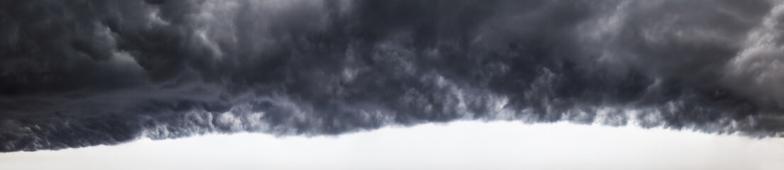 Panoramic View of a Dramatic Cloudscape during a dark, scary, stormy weather day. Taken over...