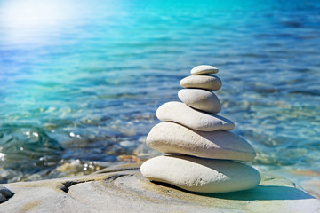 Pyramid of stones zen balance in sea