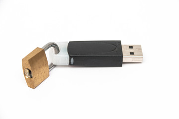 The lock on a flash drive on a white background. Close-up. Information storage security concept.