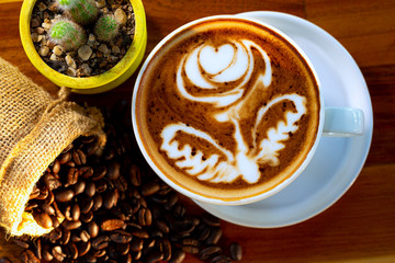 cup of hot coffee on a dark background
