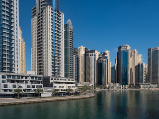 Obraz na płótnie Canvas DUBAI, UAE - February 2020: Modern buildings in Dubai Marina, Dubai, UAE. In the city of artificial channel length of 3 kilometers along the Persian Gulf, taken on February 2020 in Dubai.