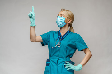 medical doctor nurse woman wearing protective mask and latex gloves - working with virtual screen