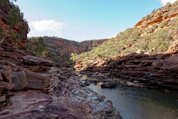 The rocks and cliffs above Murchison River under in Z-Bend in Western Australia in late afteroon with no people