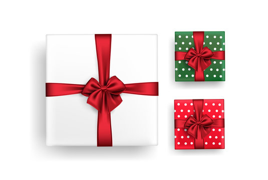 A set of gift boxes tied with red ribbon, bow.Isolated vector stock image on a white background of white, red and green polka dot packages.Elements or clip art for the design of postcards or banners