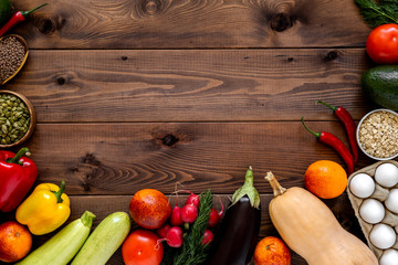 A Variety Of Vegetables Arranged On Wooden Background.