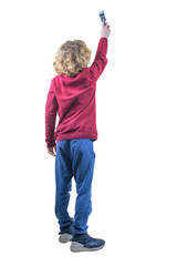 Back view of blond teenager painting on the wall